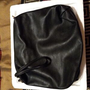 Womens Betsey Johnson purse. No strap  black flower interior dont know material